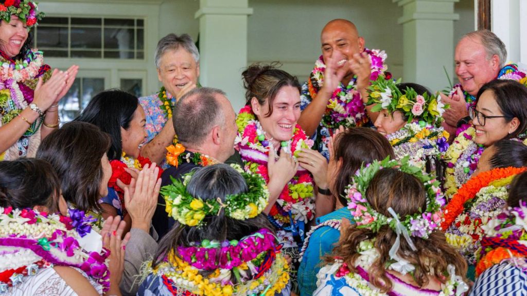 J. Elise Harrigan, a senior mentor teacher and Freshman Academy coordinator, is congratulated by Gov. Josh Green and her peers as Hawaiʻi State Teacher of the Year. (Photo Courtesy: Hawaiʻi State Department of Education)