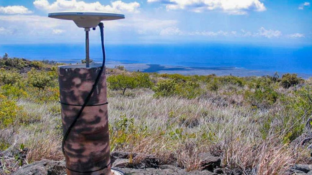 The view from a continuous GPS station on Kīlauea’s south flank, looking over the Hilina and Hōlei Pali to the ocean. This instrument was installed in 1996 to monitor seaward motion of the south flank. (Photo Credit: U.S. Geological Survey/ K. Kamibayashi)