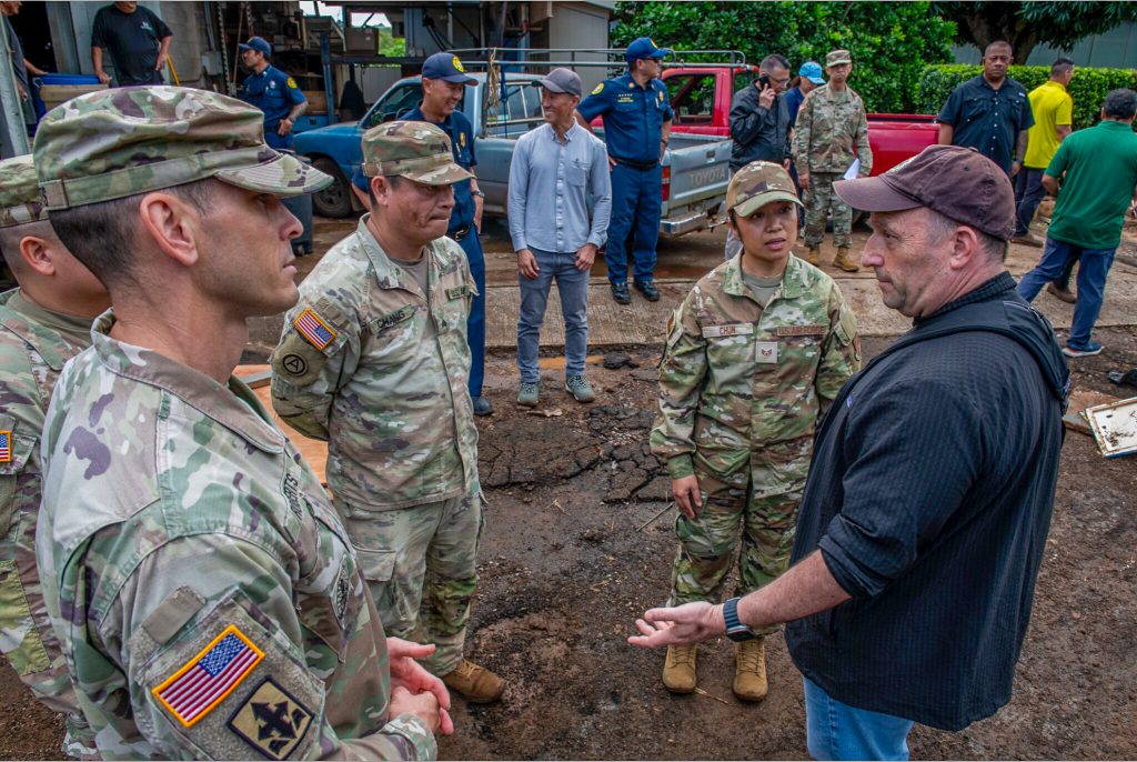 Hawaiʻi Gov. Josh Green speaks on March 23, 2026, with National Guard members deployed to help with damage caused by the recent storms on the North Shore of Oʻahu . (Photo Credit: Office of the Governor)