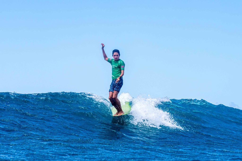 Alex Ranne of the Hawaiʻi Academy of Arts and Science won the first boys longboard title at the inaugural Hawaiʻi state high school championship held on Maui on May 2, 2026. (Ernie Black/HHSAA)