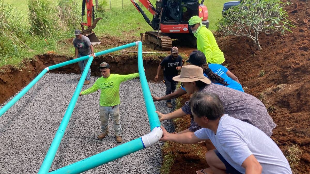 Hawaiʻi Community College students help professionals install a leach field as part of field work during a certificate program. (Photo Credit: Hawaiʻi Community College)