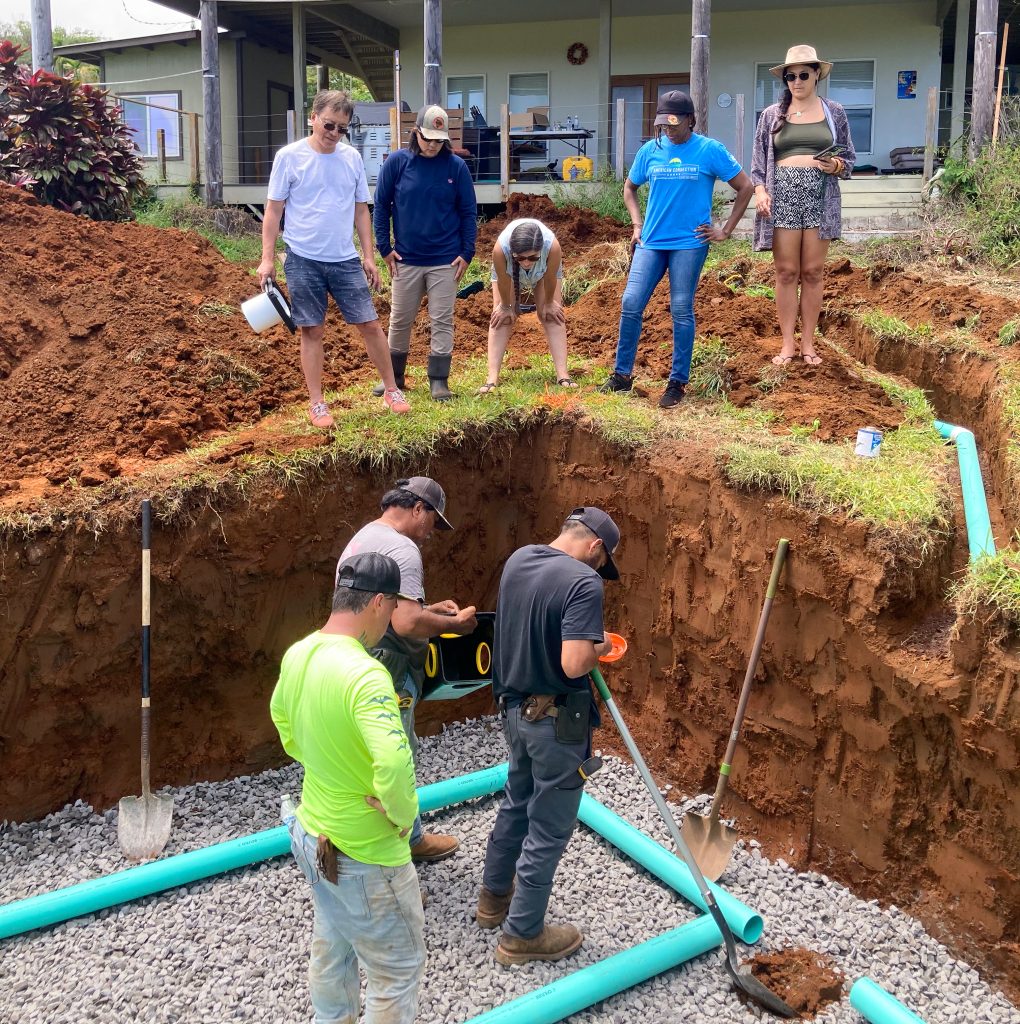 Hawaiʻi Community College students help professionals install a leach field as part of field work during a certificate program. (Photo Credit: Hawaiʻi Community College)