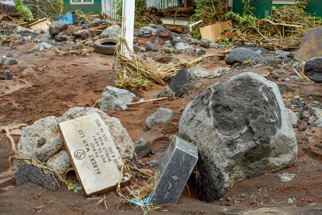 Headstones from the Nā‘ālehu Cemetery were found washed down the road into people's properties on Aug. 17, 2026, after Hurricane Lala. (Tiffany DeMasters/Big Island Now)