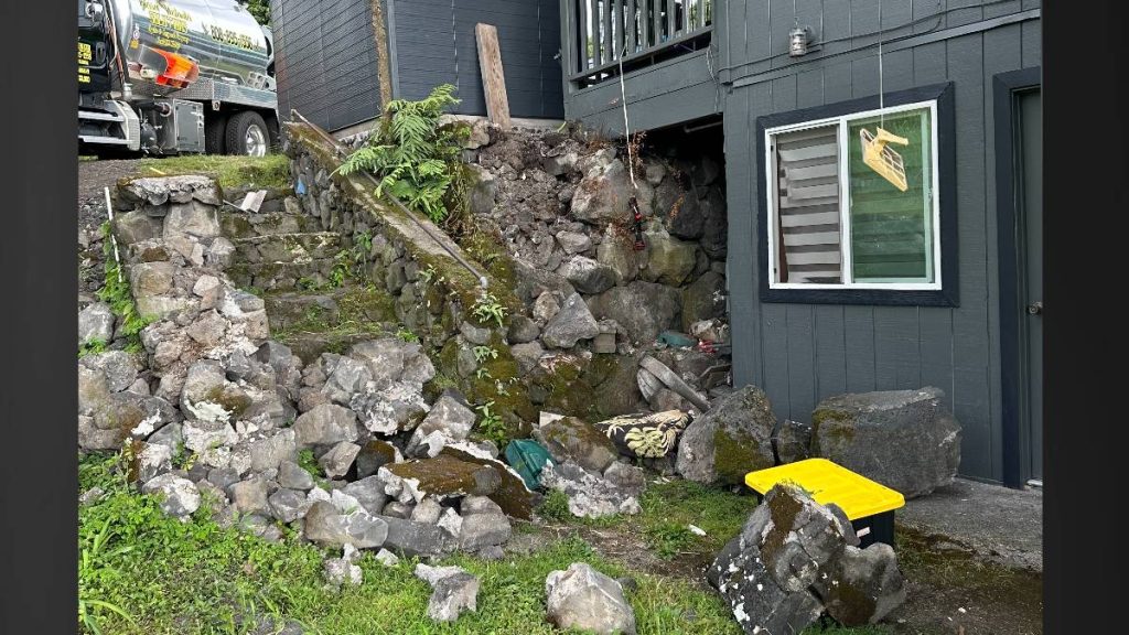 Rockwalls around Joshua Watan's home came down around the lānai following the May 22, 2026, earthquake. (Photo courtesy: Joshua Watan via Big Island Now)