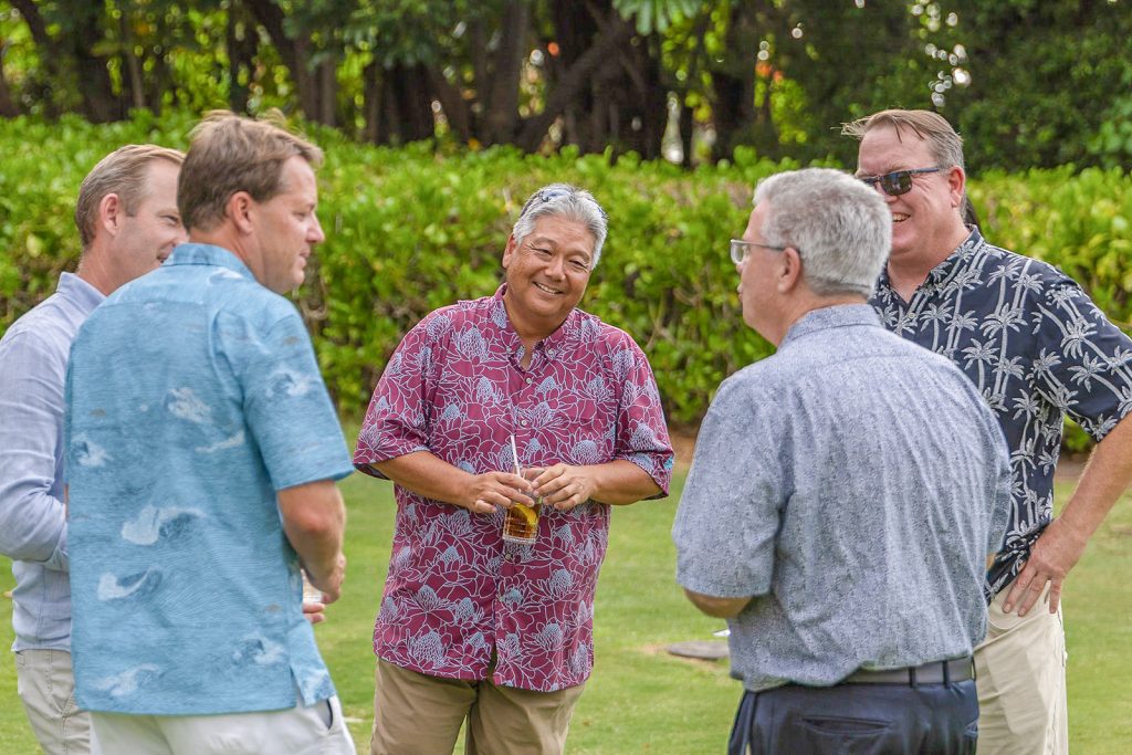 Community and visitor-industry leaders share a moment at the 2026 Charity Walk celebration in Waimea. (Photo Credit: Hawaiʻi Family Portraits)