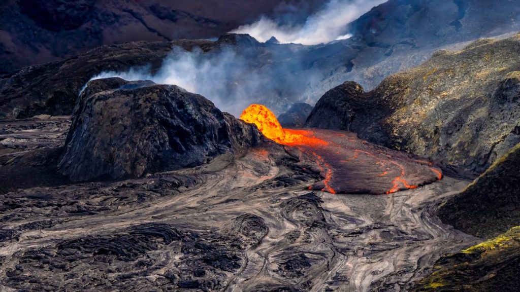 Lava erupts from the north vent in the shape of a dome in Halemaʻumaʻu crater, Hawai'i Volcanoes National Park. (Photo Credit: J. Wei/National Park Service)