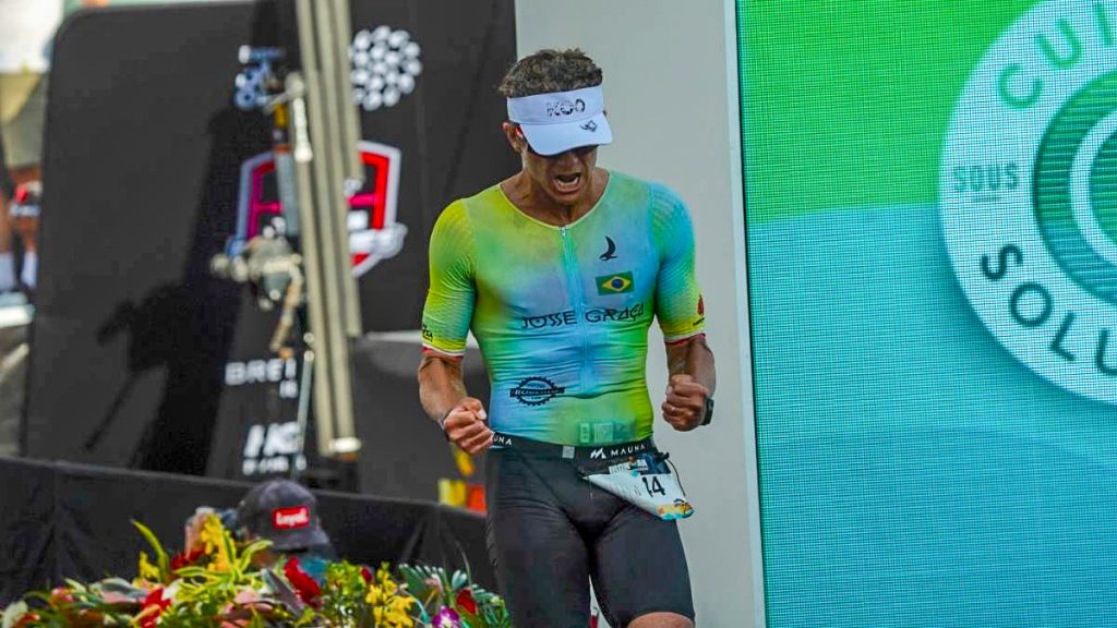 José Graca of Kailua-Kona crosses the finish line at the Ironman World Championship in Kona on Oct. 10, 2026. (Tiffany DeMasters/Big Island Now)