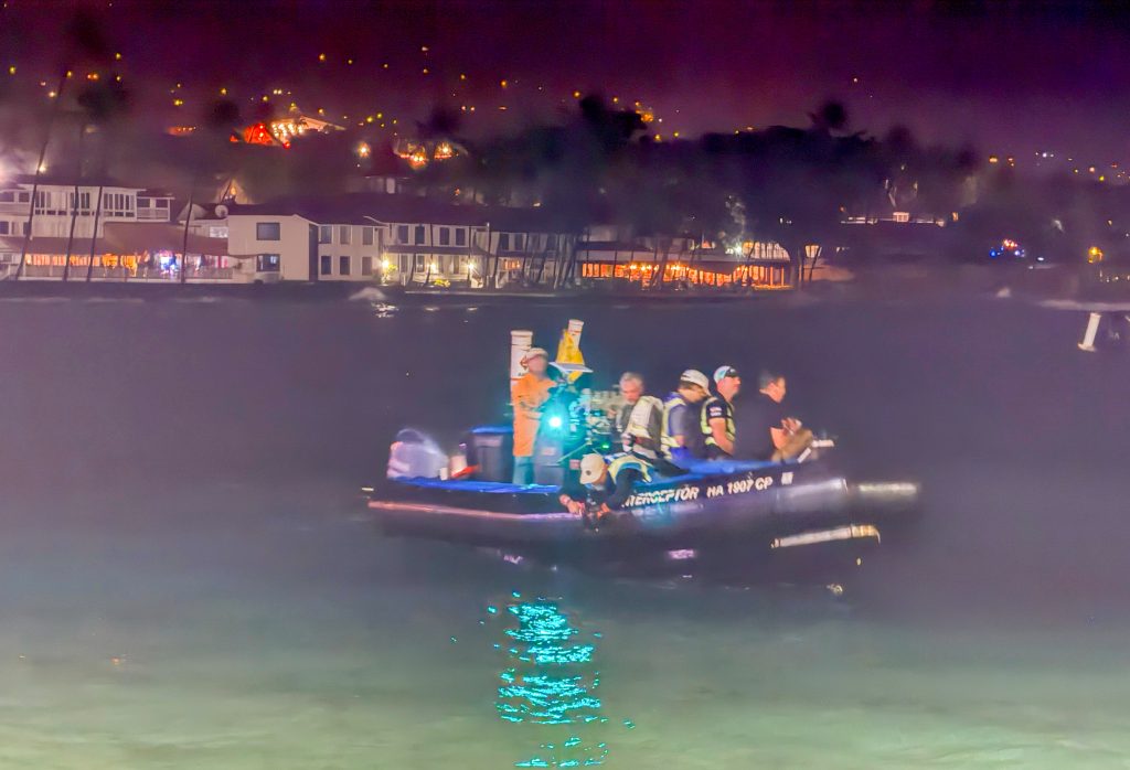 A TV crew is out on Kailua Bay to film the 2.4-mile swim portion of the Ironman World Championship on Oct. 10, 2026. (Tiffany DeMasters/Big Island Now)