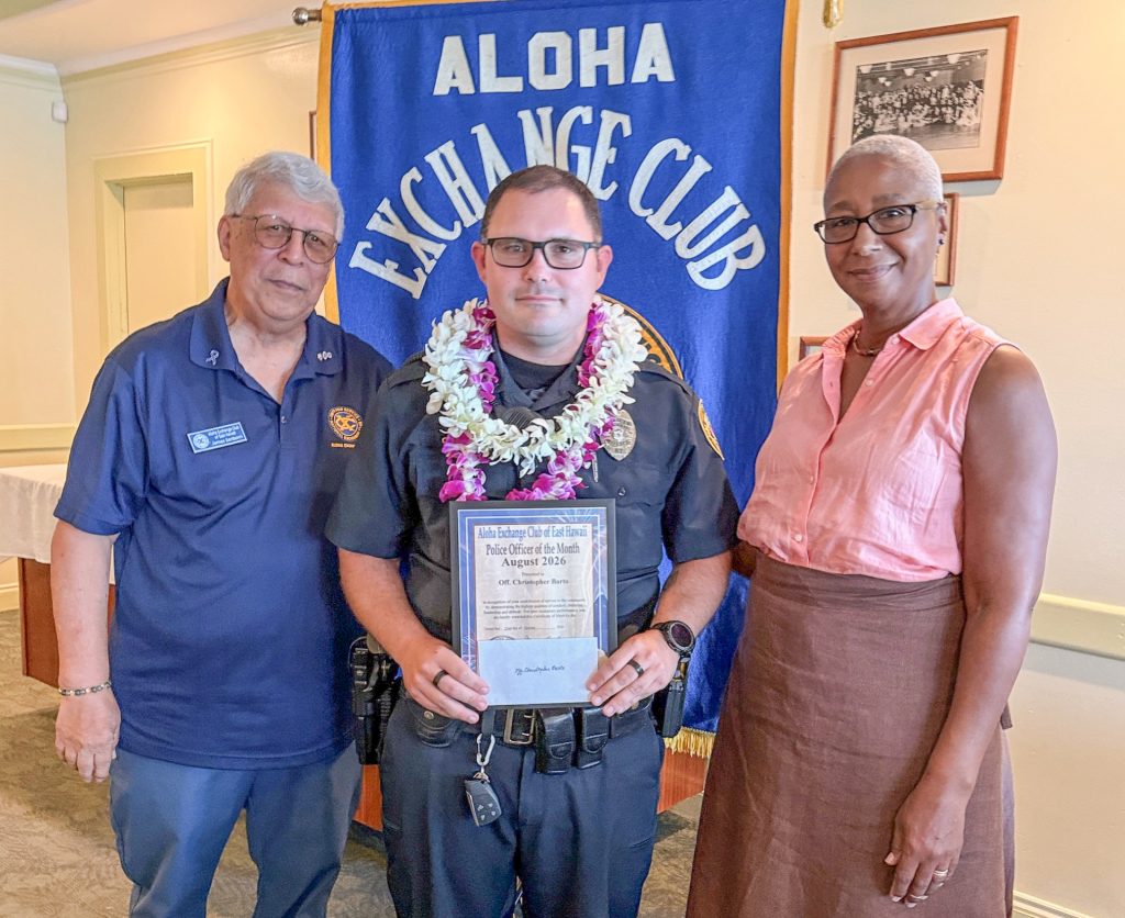 Hilo Community Policing Officer Christopher Barto (middle) was honored as the August Officer of the Month at the Aloha Exchange Club of East Hawaiʻi luncheon on Oct. 22, 2026. (Photo Credit: Aloha Exchange Club of East Hawaiʻi)